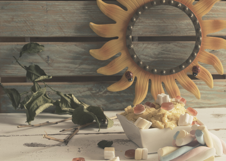 cream of lemon ice cream with sugar sponges and jelly beansの写真素材