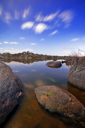 A natural setting where granite rocks and pools of water that are home to a multitude of species of flora and fauna stand out.の写真素材