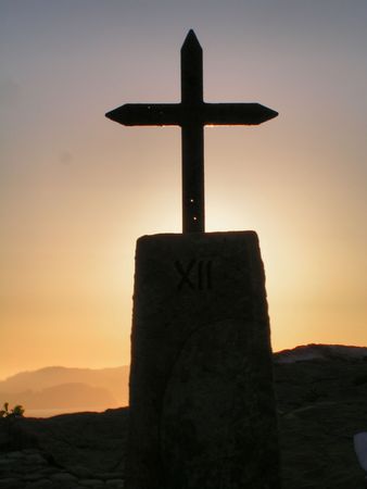 Sunset with Cross at San Juan of Gastelugatxe in the Basque Countryの写真素材