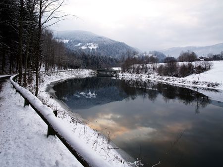 Winter scene with a riverの写真素材