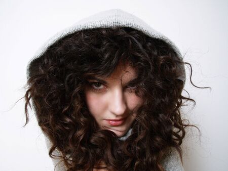 Young girl in hood posingの写真素材