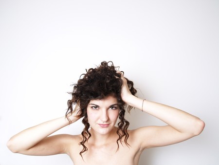 Beautiful yung woman touches her hair の写真素材