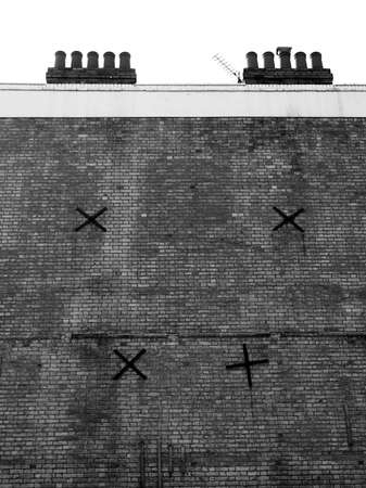 Massive firewall with chimneyの写真素材