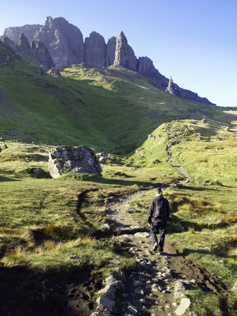 Young man hiking in the mountainsの写真素材