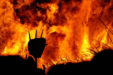 Flames of burning fire and a forkの写真素材