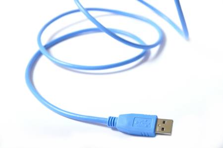 Blue USB cable on white backgroundの写真素材