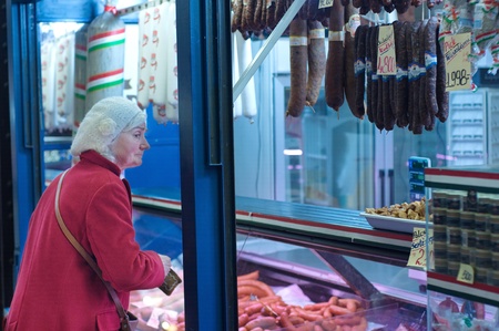 Old lady at the butcher shopのeditorial素材