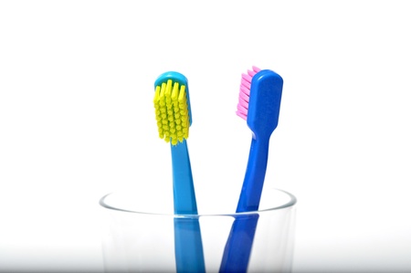 Colorful toothbrushes in a glassの写真素材