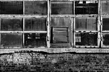 Windows of an old abandoned factoryの写真素材