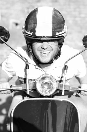 Young man on a scooterの写真素材