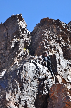 Young man climbing mountainsの写真素材