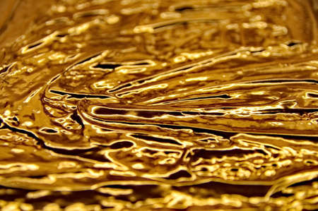 Flowing golden chocolateの写真素材