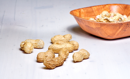 Peanuts in a brown bowl