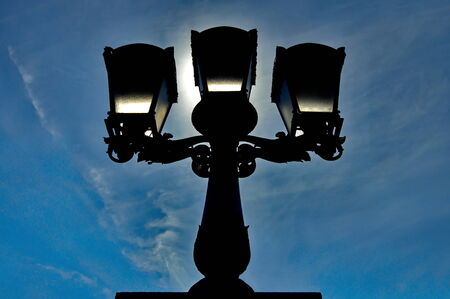 Silhouette of a decorative streetlightの写真素材