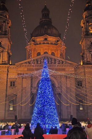BUDAPEST, HUNGARY - DECEMBER 16, 2012: Weekend in Budaopest before Christmas. People skating around a Christmas Tree.のeditorial素材