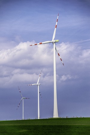 Windmill on a green fieldの写真素材