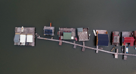 Aerial view of fishing buildings on a lakeの写真素材
