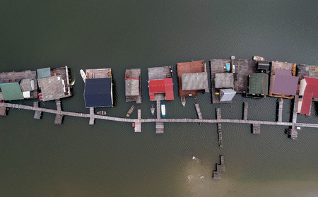 Aerial view of fishing buildings on a lakeの写真素材