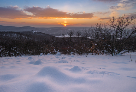 Hills covered by white snowの写真素材