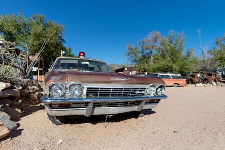 Old rusty red car abandonedの写真素材