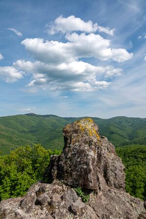 Green hills and cludy sky at springの写真素材