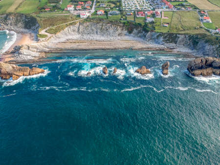 Dramatic view of Playa de la Arnia, rocky coastline in Santander ,Cantabria, Spainの写真素材