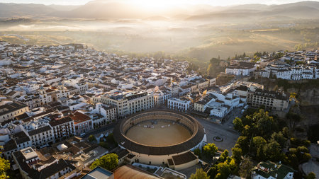Bullring of the Royal Cavalry of Ronda aerial view at sunrise in Spainの写真素材