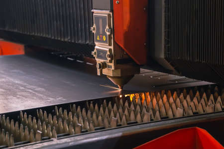 The laser machine is engaged in metal cutting at the factory