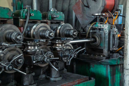A metalworking machine produces a pipe at the factory