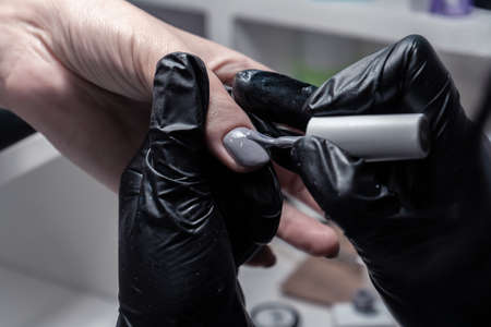 The process of manicure in a beauty salon close-up