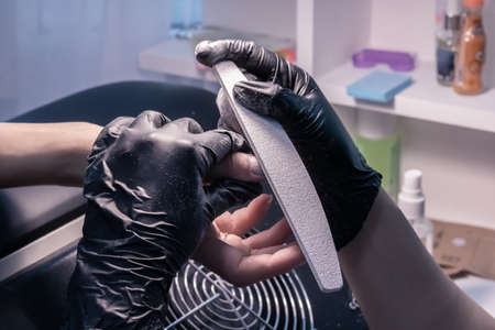 The process of manicure in a beauty salon close-up