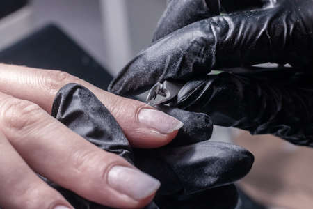 The process of manicure in a beauty salon close-up. cuticle removalの写真素材