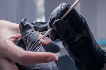 The process of manicure in a beauty salon close-upの写真素材