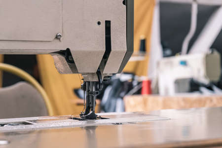 Sewing machine needles close-up in the workshopの写真素材