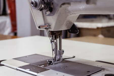 Sewing machine needles close-up in the workshopの写真素材