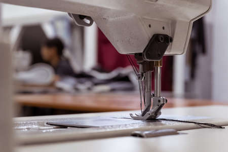 Sewing machine needles close-up in the workshopの写真素材