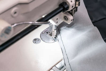 Sewing machine needles close-up in the workshopの写真素材