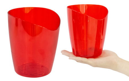 Red empty flower pot made of plastic. isolated from the backgroundの写真素材