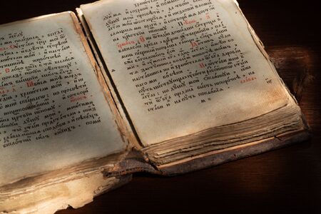 Antique book on a wooden tableの写真素材