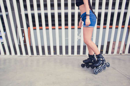 teen girl feet skating outdoor in the city