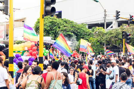 people with lgbt flags and balloons in lgbt pride outdoors in the city for their rightsのeditorial素材