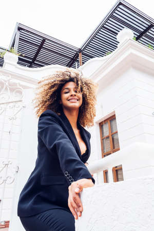 beautiful business woman wearing elegant cheerful in the city enjoying her day at home outdoor white...