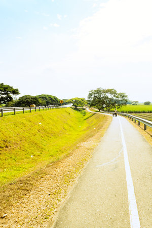 bicycle road landscape in nature on beautiful sunny day outside of the city.の写真素材