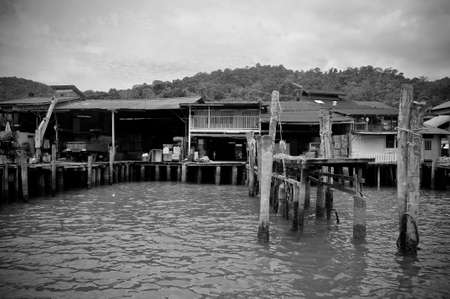 Pangkor Island, Malaysia, March 13, 2011: Fishing village jetty in black & whiteのeditorial素材