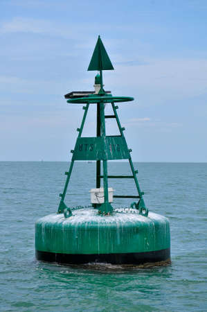 Pangkor Island, Malaysia, March 13, 2011: Passing a buoy at Pangkor Island towards Lumut Jettyのeditorial素材