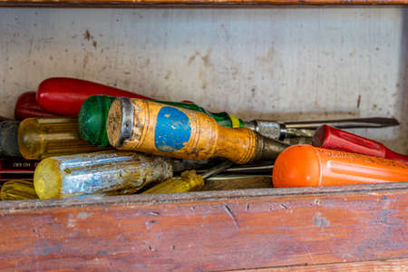 Swift Current, SK/Canada- May 1, 2020: A collection of old screwdrivers in an old workshop