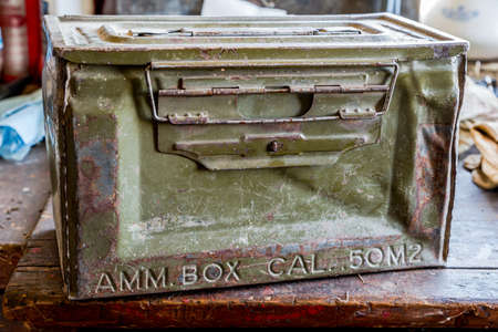 A vintage World War 2 ammunition box on a work bench in an old workshopのeditorial素材
