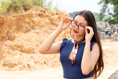 young woman posing in the desertedの写真素材