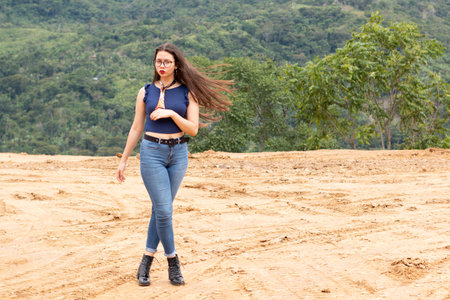 Woman located in the middle of the desert and half jungle.の写真素材