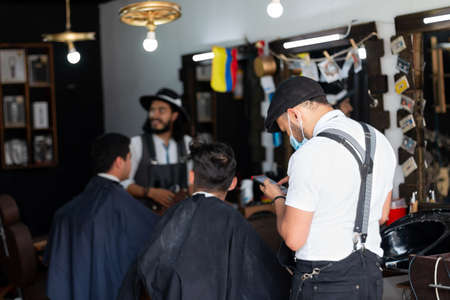 Full barbershop. Professional and elegant barbers in your Latin storeの写真素材